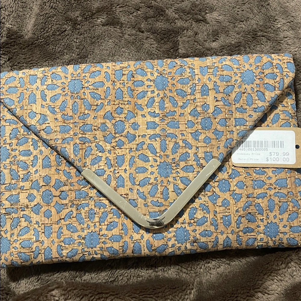 Sondra Roberts ‘Perforated cork’ envelope clutch with Denim underlay.